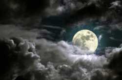 Full moon in a cloudy night.